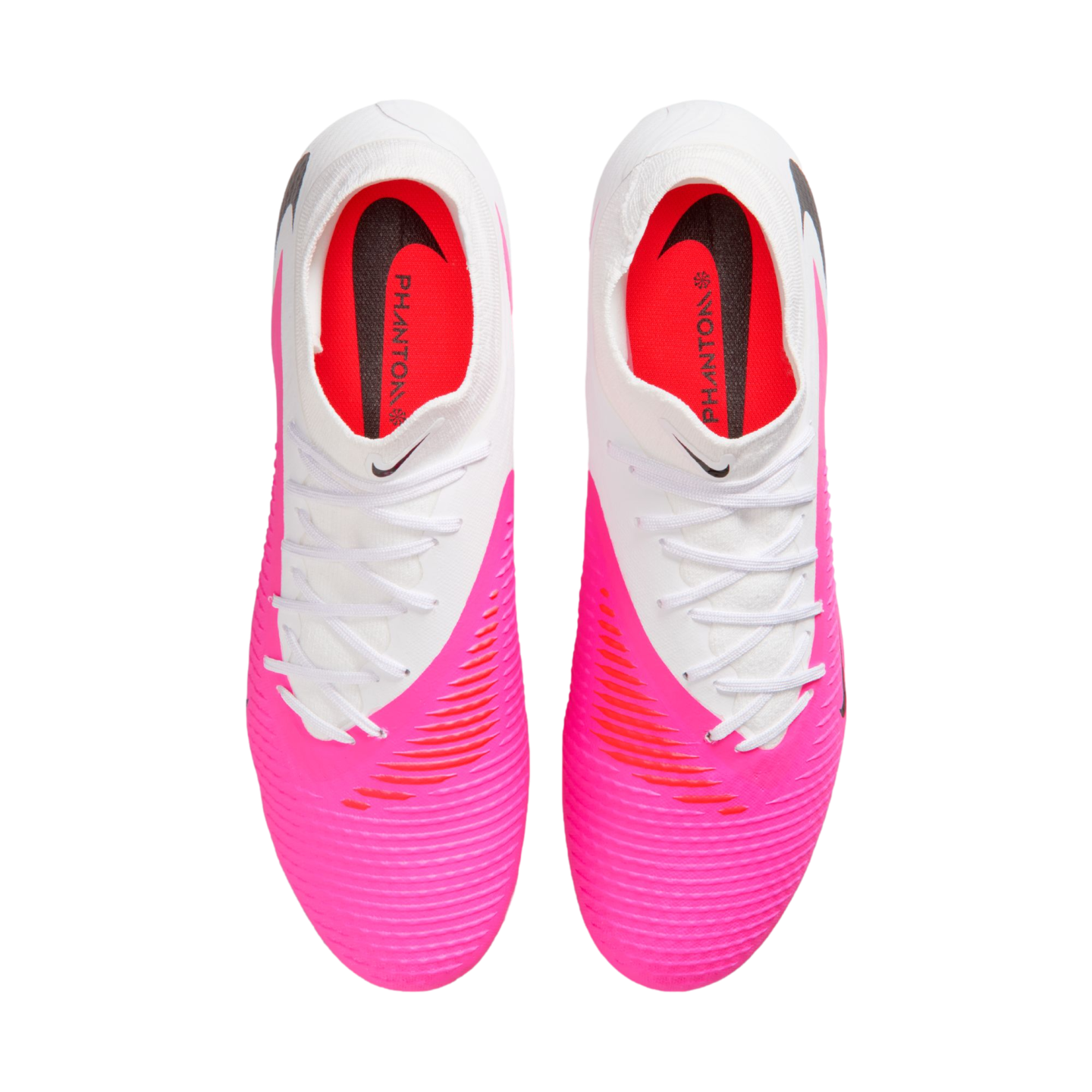 Top-down view of Nike Phantom Luna soccer cleats featuring a white and bright pink colorway with white laces and textured uppers.