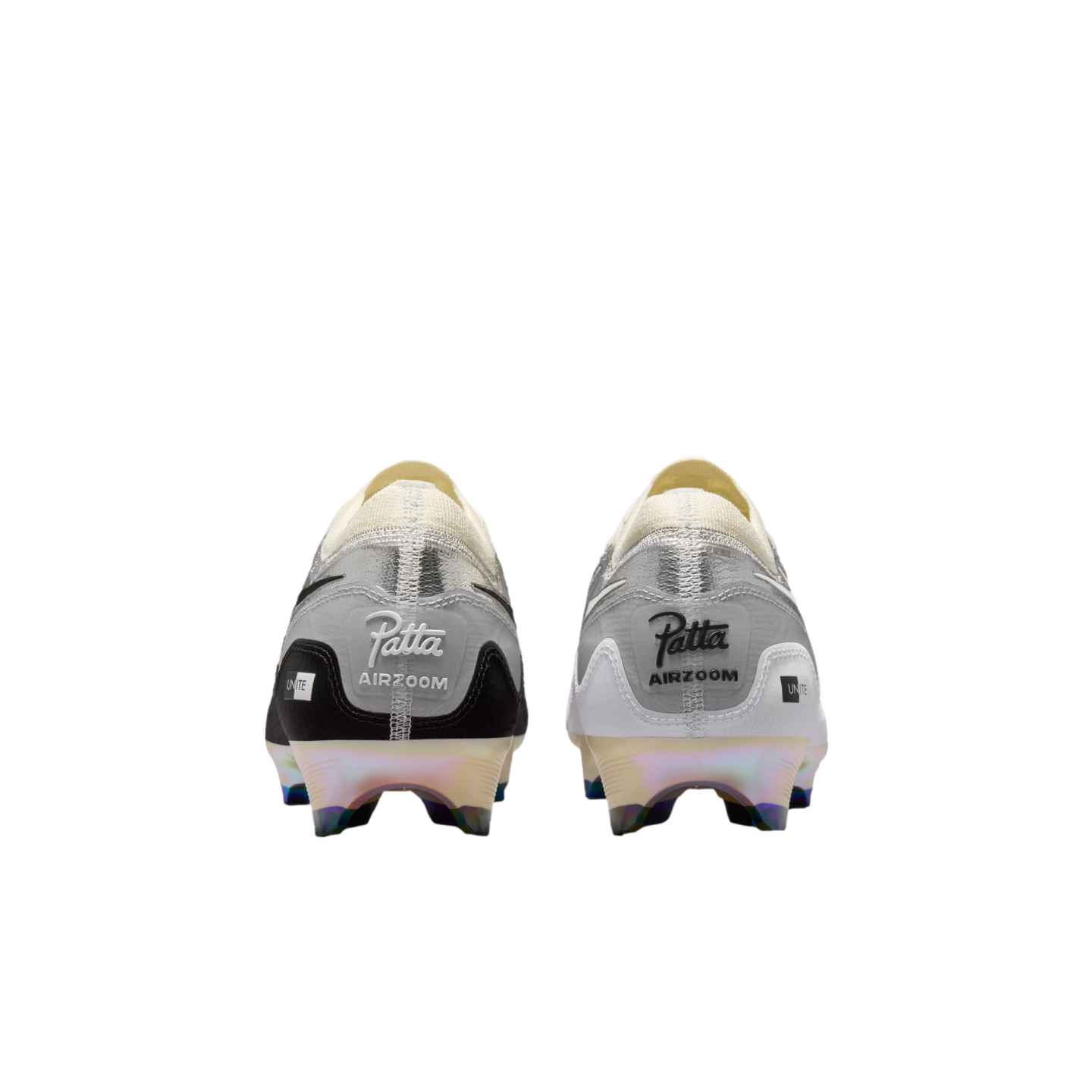 Rear view of mismatched black and white Nike x Patta Air Zoom soccer cleats with iridescent soles against a black background.