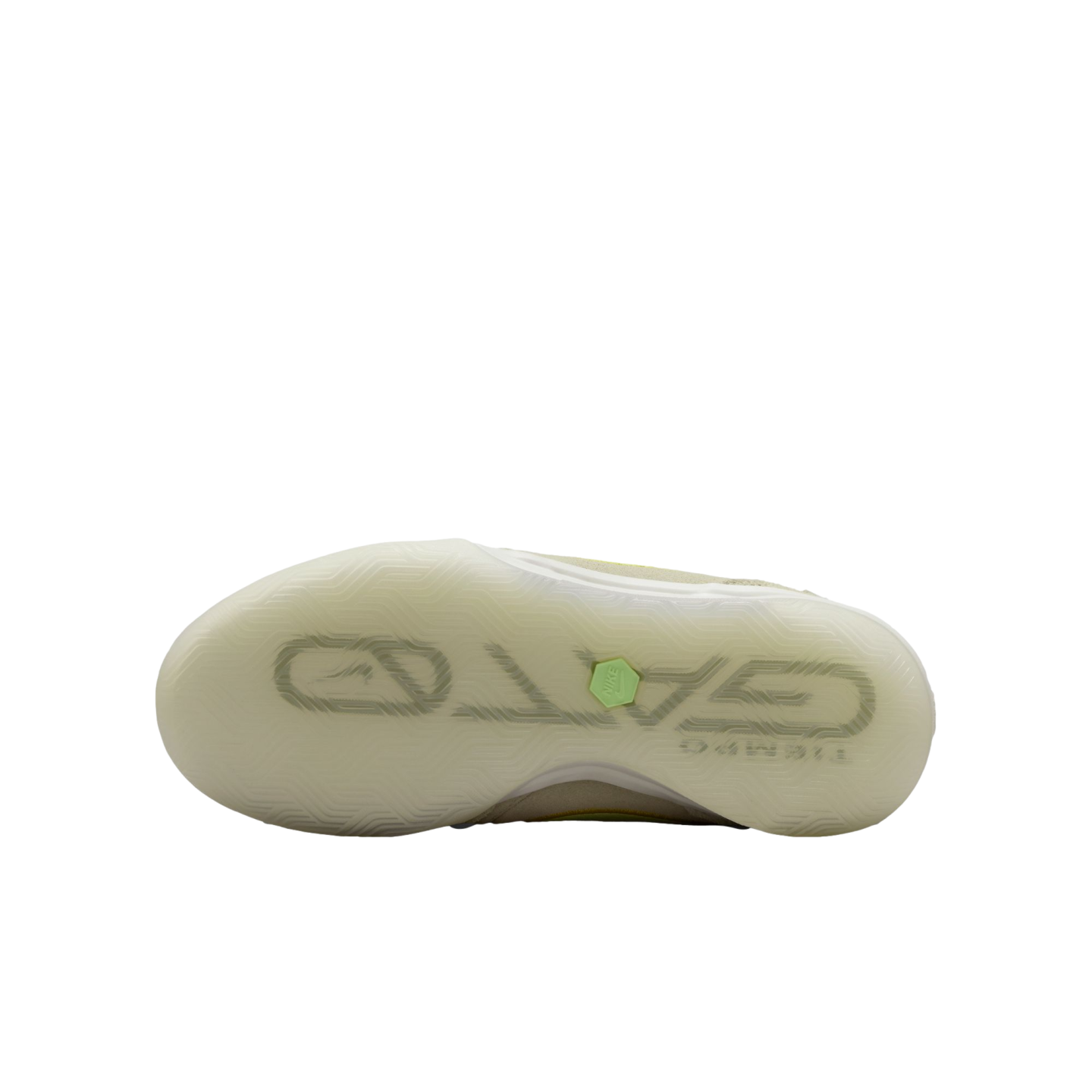 Translucent sole of a Nike Gato indoor soccer shoe showing the large 'GATO' logo and a small green hexagonal Nike emblem against a black background.