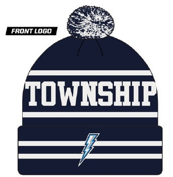 Navy blue beanie with white stripes, "TOWNSHIP" text, and a lightning bolt logo on the cuff. Features a speckled navy and white pom-pom on top.