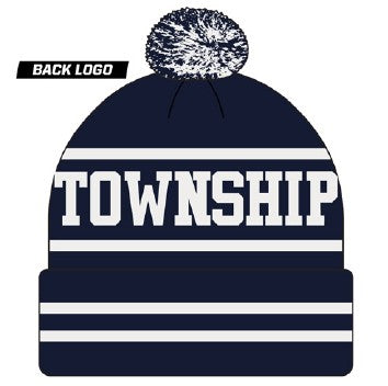 Navy blue knit pom-pom beanie with "TOWNSHIP" in white block lettering between white horizontal stripes on the crown and folded cuff.