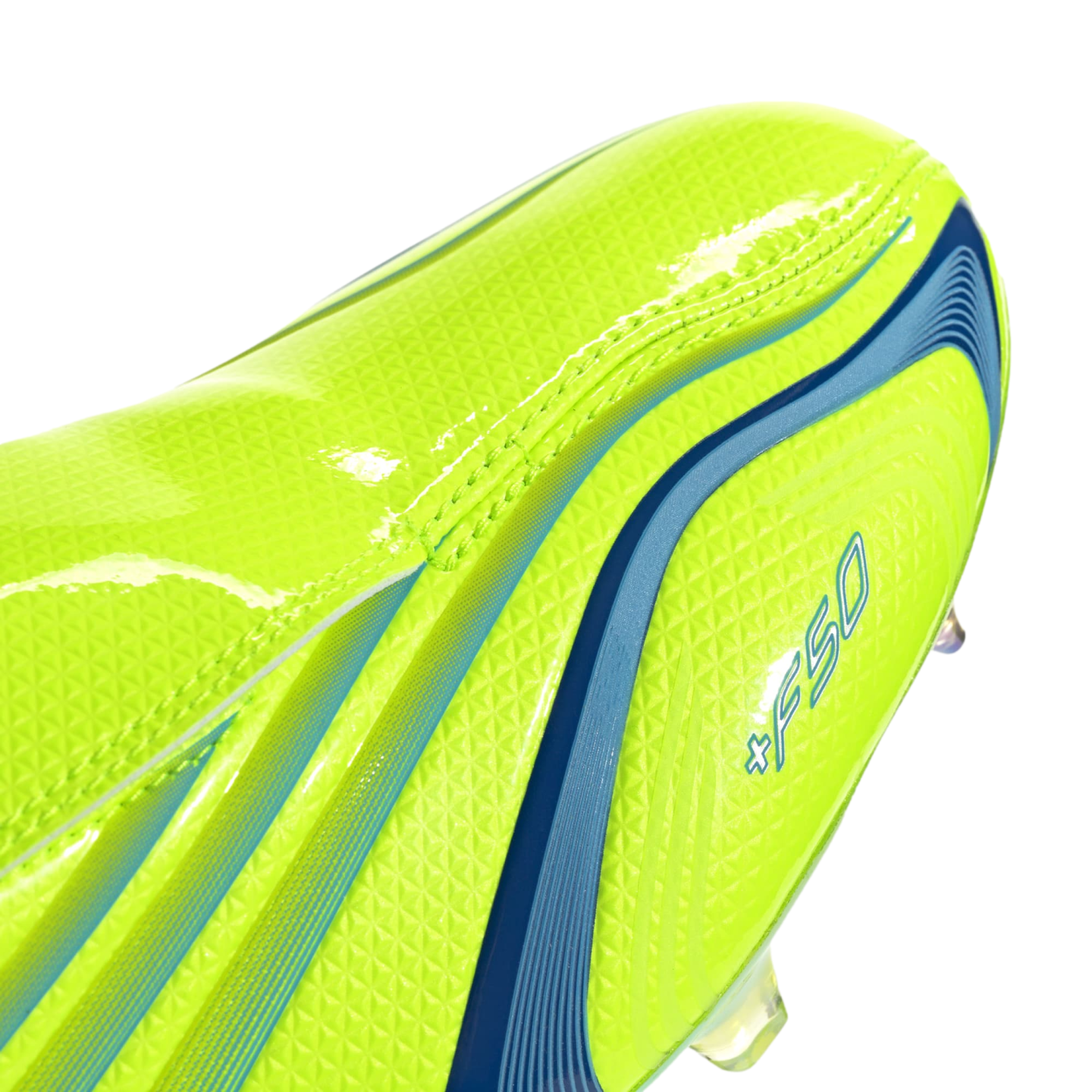 Close-up of a lime green soccer cleat featuring blue stripes, a textured finish, and +F50 branding.