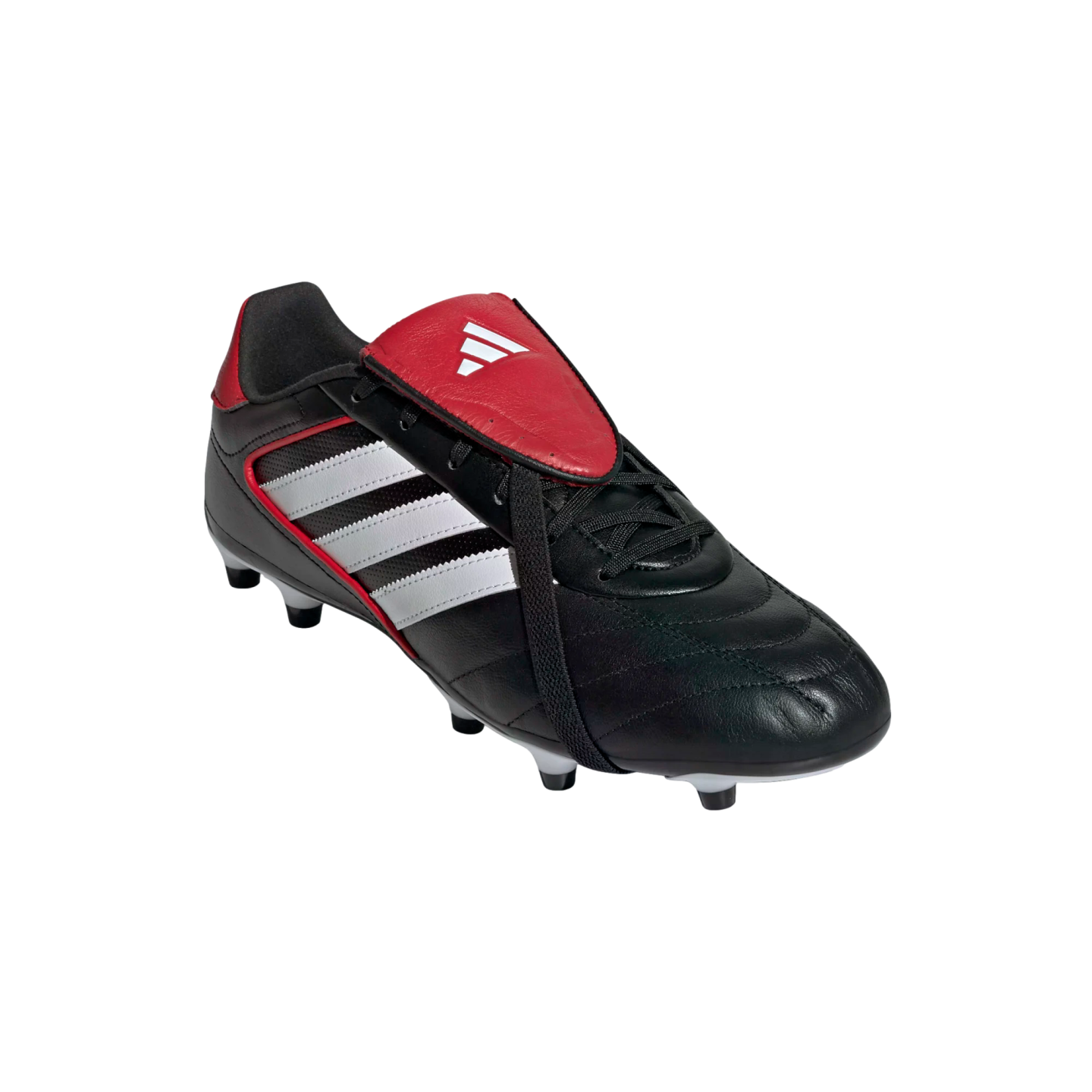 A black leather Adidas soccer cleat with three white stripes and a red fold-over tongue, isolated on a black background.
