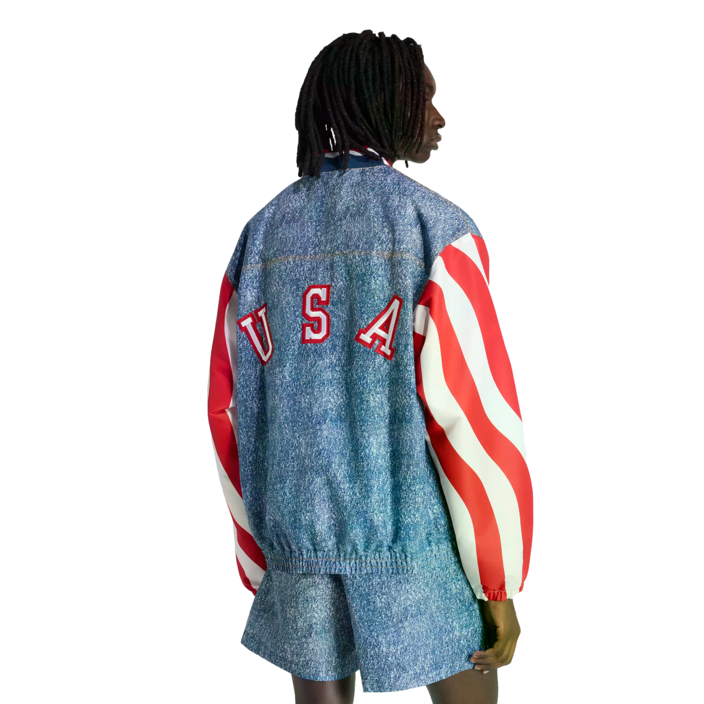Back view of a person wearing a denim-print jacket with "USA" on the back, red and white striped sleeves, and matching shorts.
