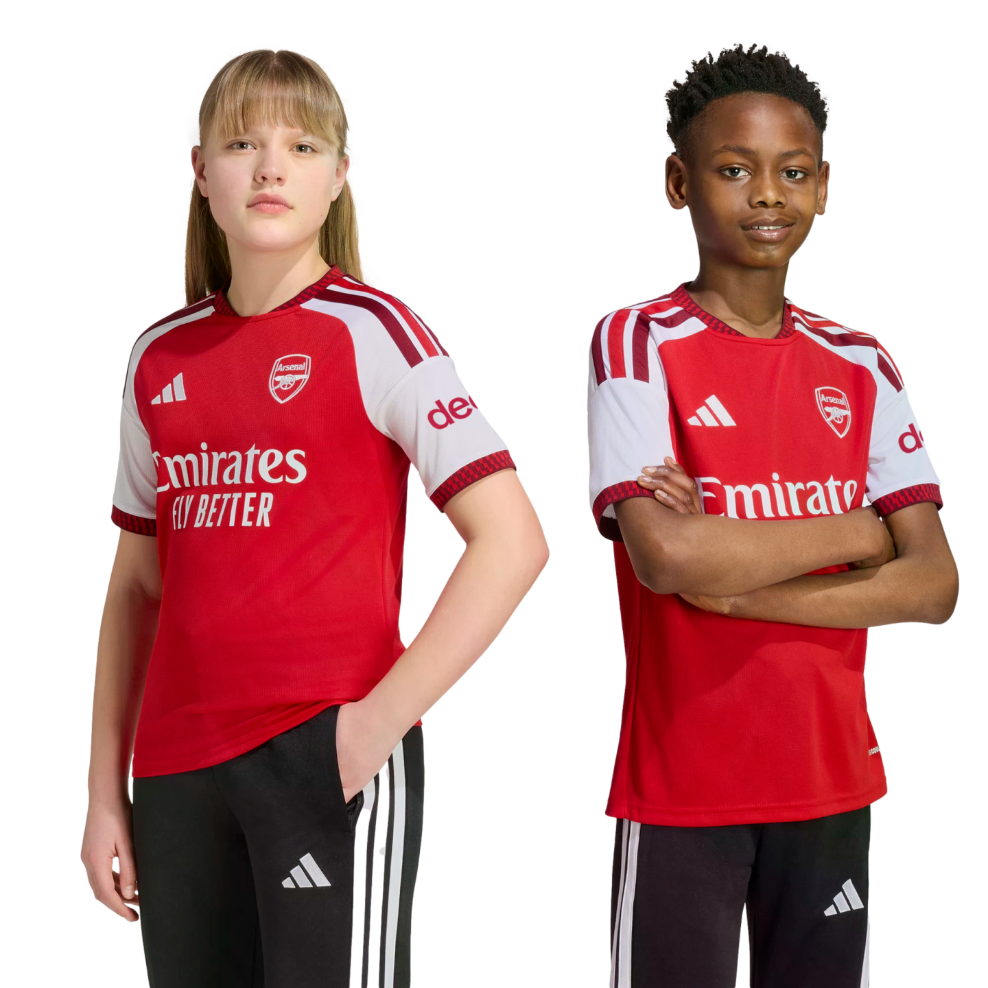 A girl and a boy pose side-by-side in official Arsenal home football kits against a plain white background.