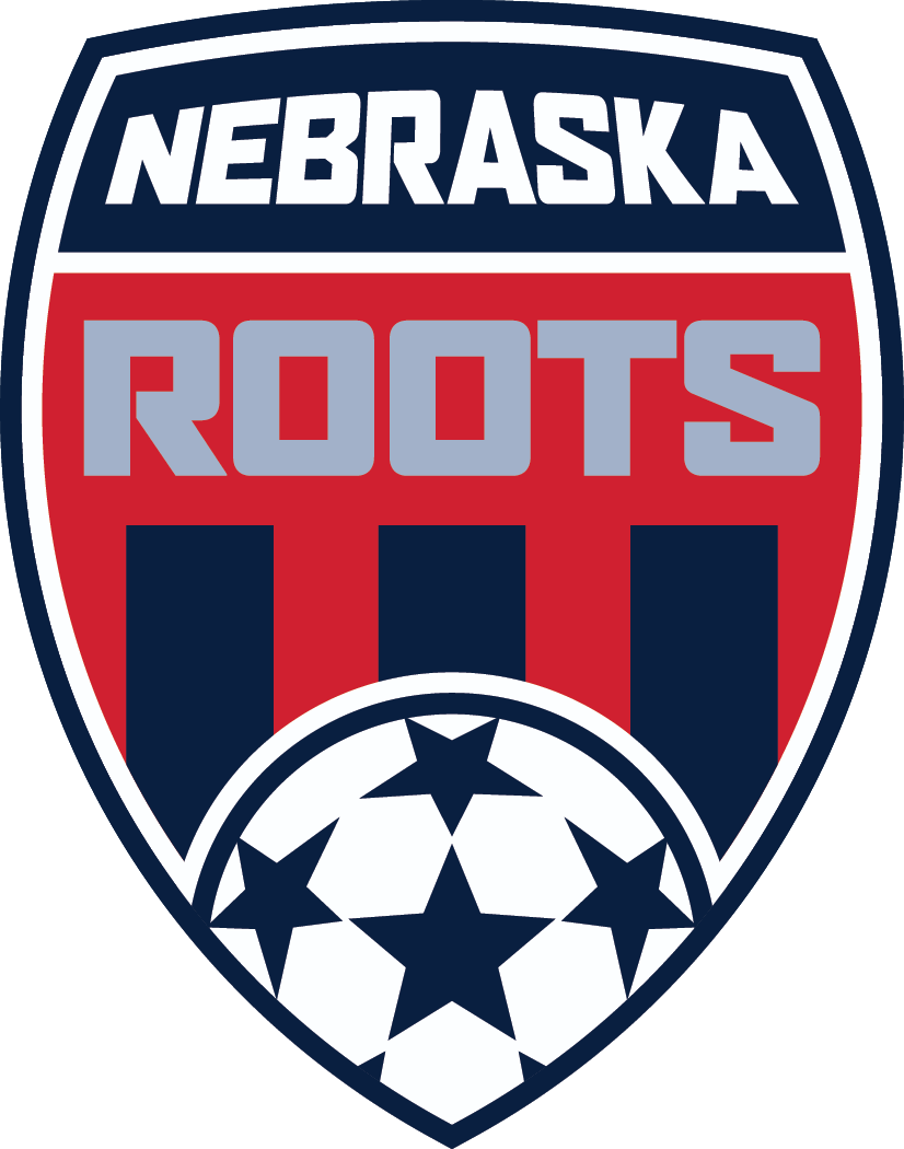 Shield logo for Nebraska Roots soccer featuring bold text over a red and blue background with vertical stripes and a star-patterned soccer ball at the bottom.