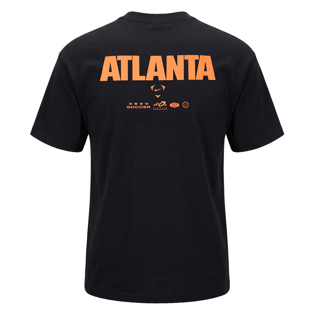 Rear view of a black Nike t-shirt with large orange "ATLANTA" text and smaller brand logos on the upper back.