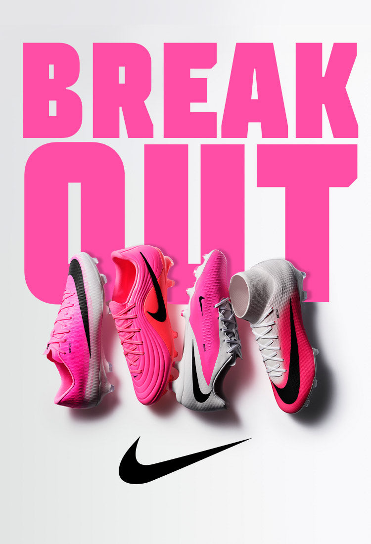 A Nike advertisement featuring pink and white soccer cleats arranged under the bold pink text "BREAK OUT," with a black Nike swoosh logo at the bottom.