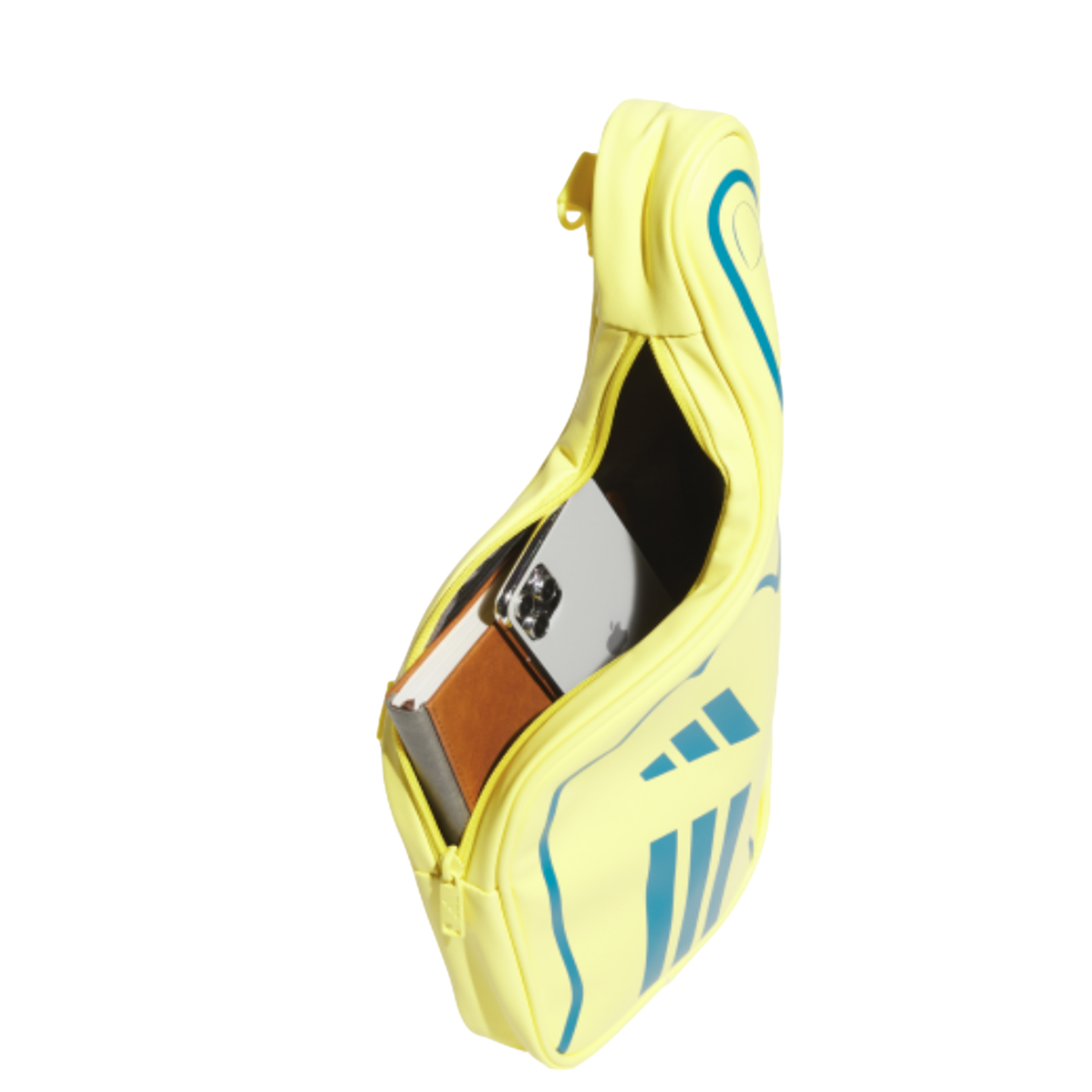 A yellow Adidas bag against a black background, zipped open to show a white smartphone and a brown notebook inside.