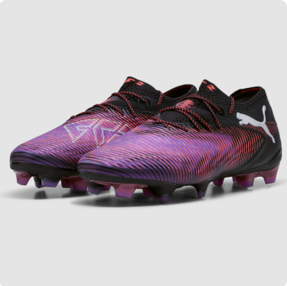 A pair of Puma soccer cleats with a black and iridescent purple-to-pink gradient design, featuring a white logo on the side and a studded sole.