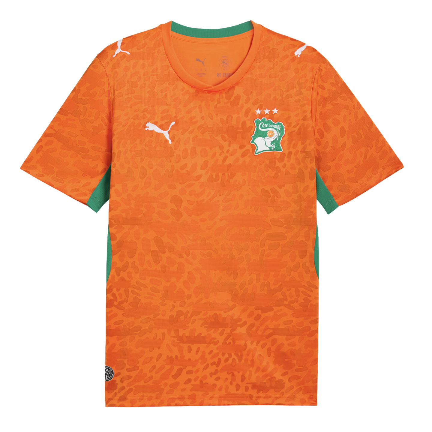 An orange Puma soccer jersey for the Côte d'Ivoire national team. It features an all-over tonal leopard print pattern, a green collar, and green side panels. The team's elephant crest with three stars is on the left chest, and white Puma logos are on the right chest and both shoulders.