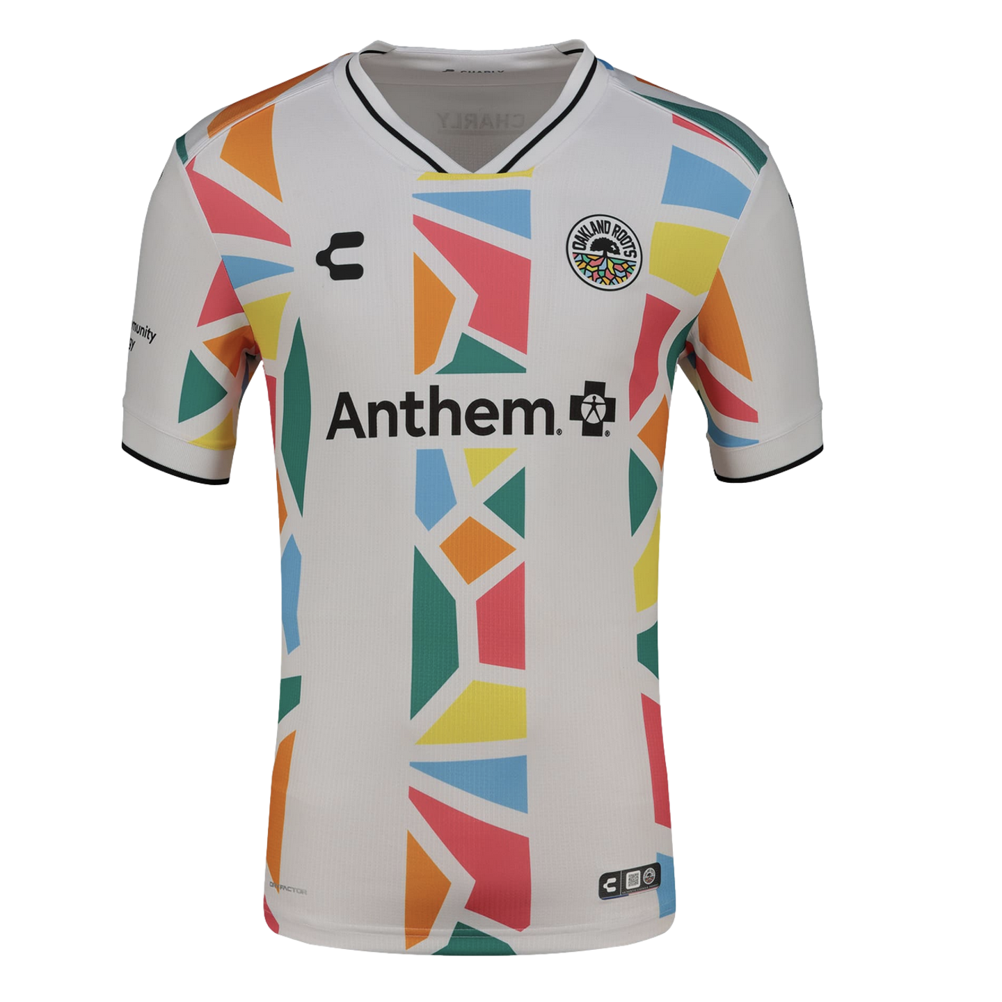A white Oakland Roots soccer jersey featuring a colorful geometric mosaic pattern in orange, blue, pink, yellow, and green running vertically down the center and along the sides. The jersey includes the "Anthem" sponsor logo across the chest, the team crest on the upper left, and a black-and-white v-neck.