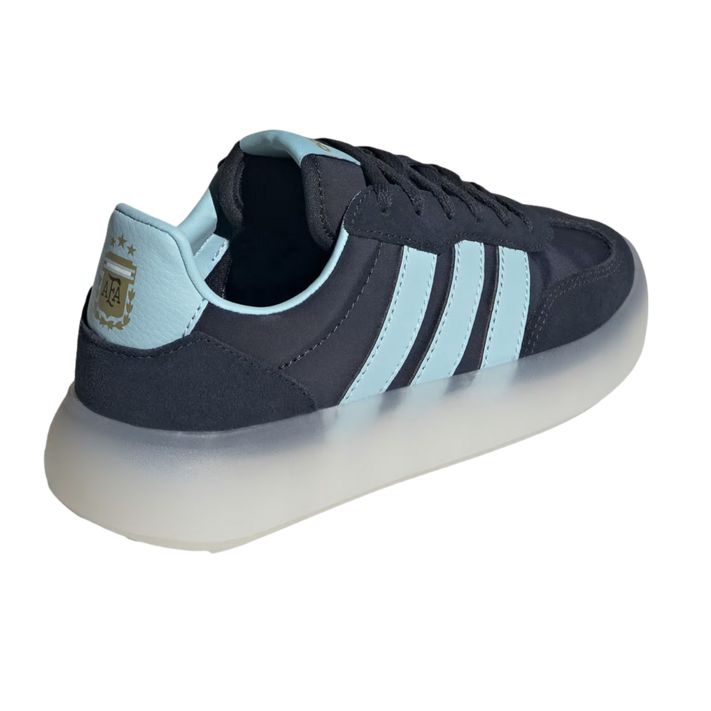 A navy blue and light blue sneaker shown from a rear three-quarter angle against a black background. It features three light blue side stripes, a light blue heel tab with a gold Argentina national football team (AFA) crest and three stars, and a thick, translucent white platform sole.