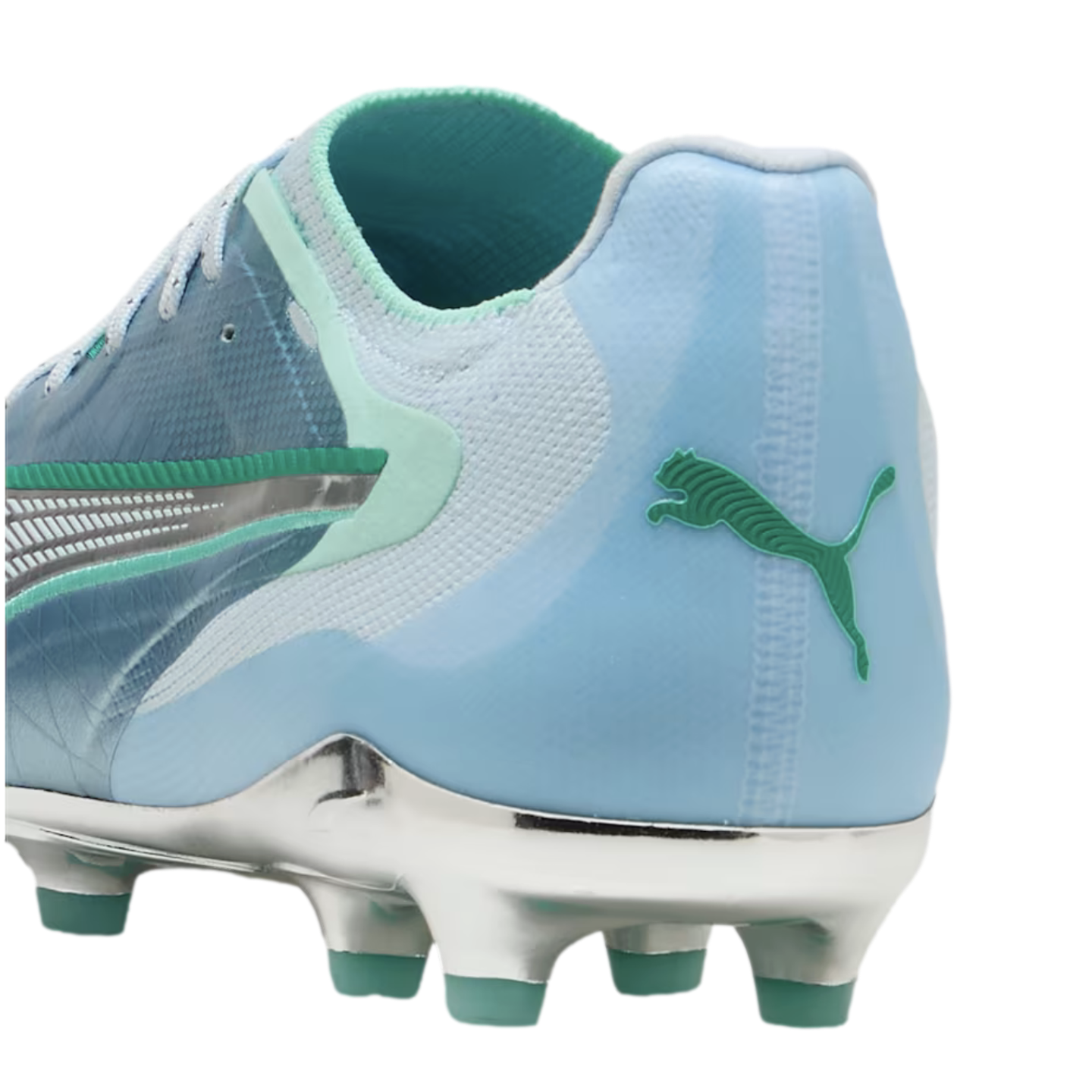 Heel of a light blue Puma soccer cleat with a green jumping cat logo and a metallic silver soleplate with teal studs.