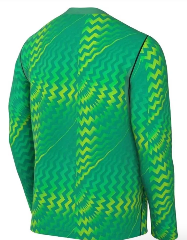 Back view of a green long-sleeved athletic jersey with a vibrant, hypnotic pattern of swirling zigzags in shades of neon yellow and lime.