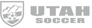 The Utah Soccer logo with a shield featuring mountain peaks and a soccer ball next to the text "UTAH SOCCER" in bold block letters.